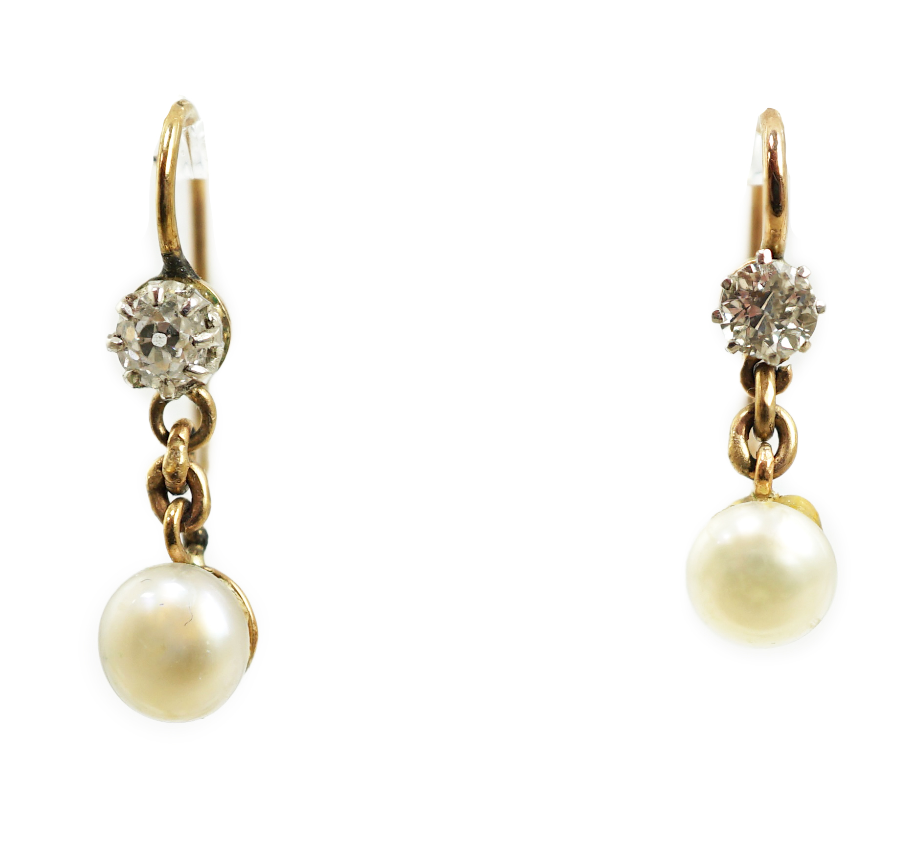 A pair of late 19th/early 20th century gold, single stone diamond and single stone button pearl set drop earrings